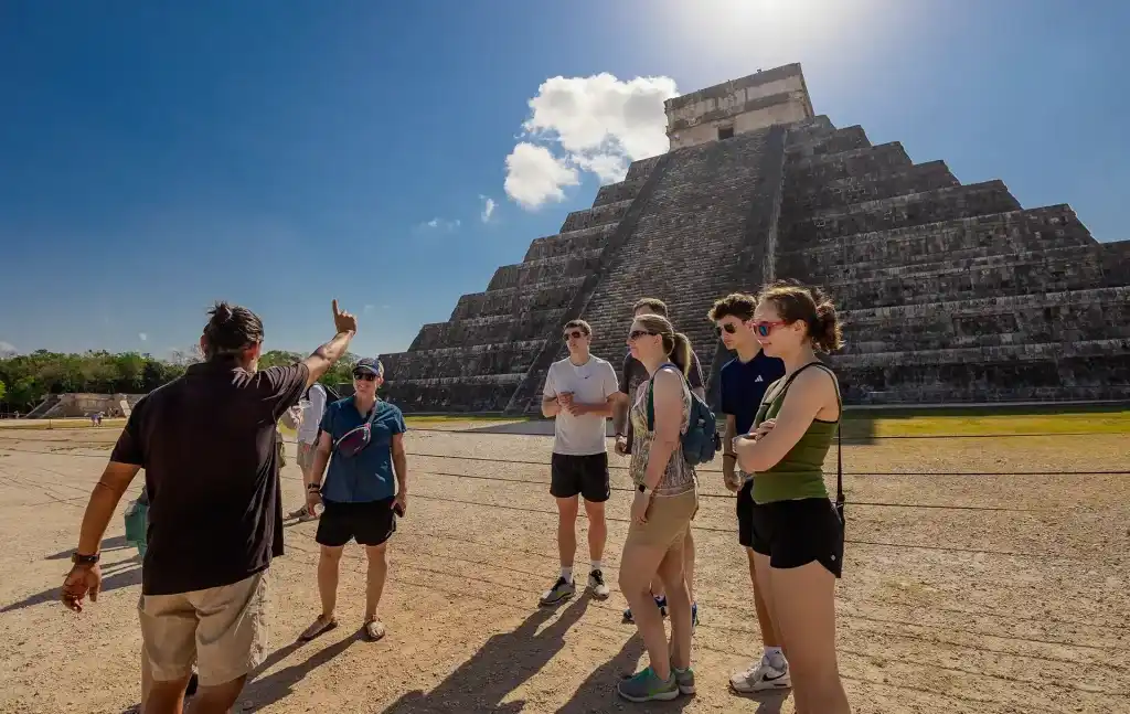 Xaman-Ha Connections certified tour guide leading a private tour at Chichen Itza.