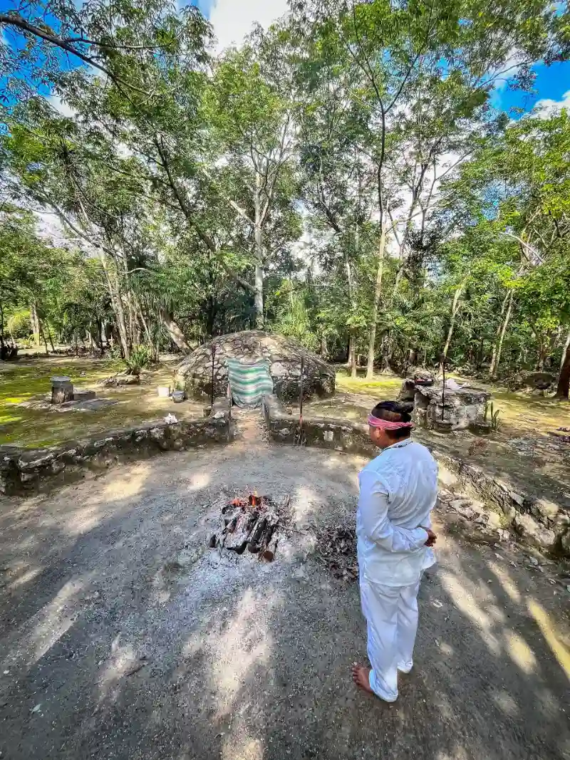 Mayan guide preparing a traditional temazcal ceremony in the jungle near Tulum.