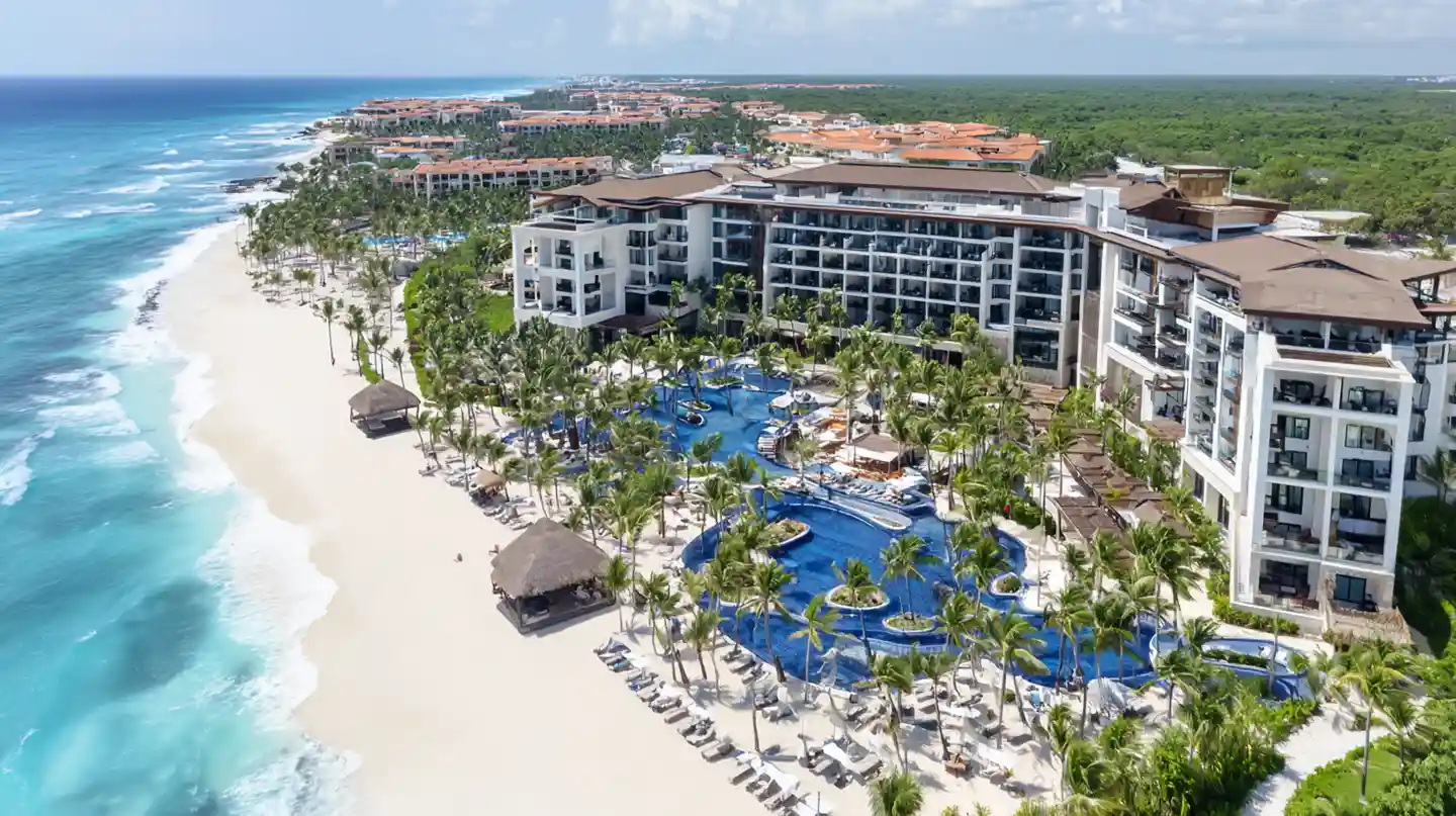 Luxury all-inclusive resort in Riviera Maya with beachfront access and large lagoon-style pools.