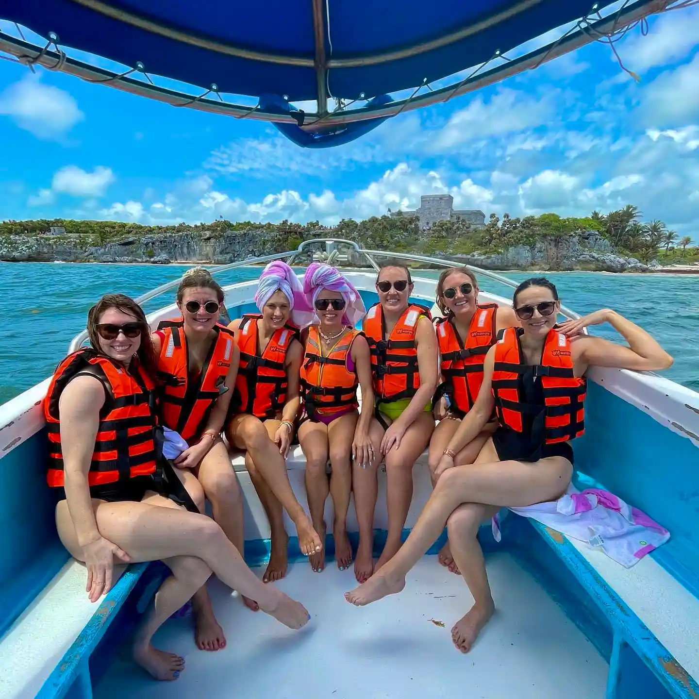 Women on private yacht enjoying a relaxed day.