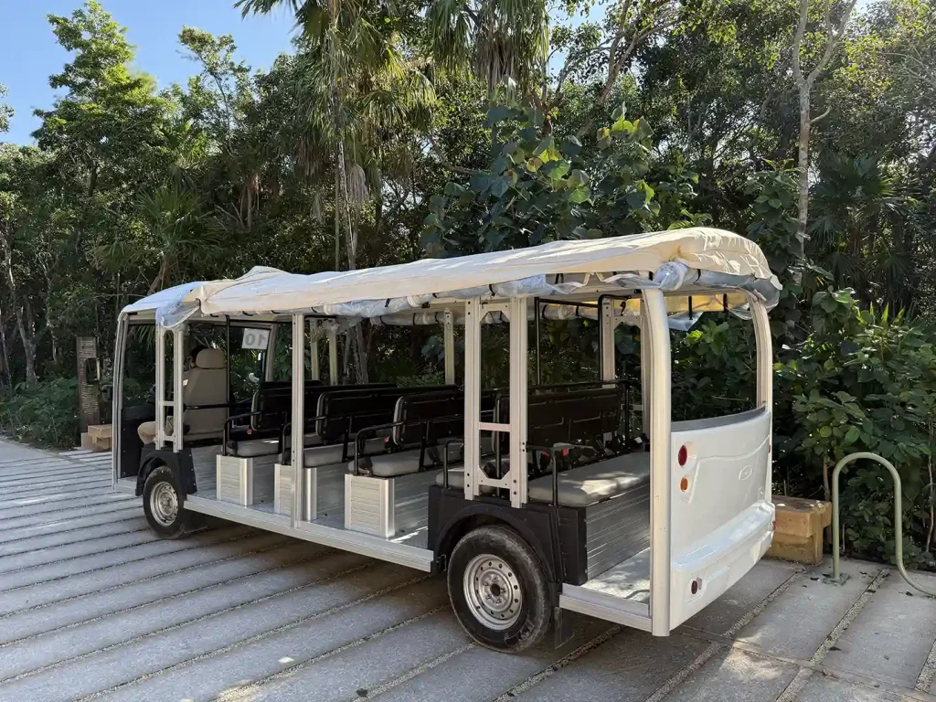 Open-air electric shuttle at the Tulum archaeological site.