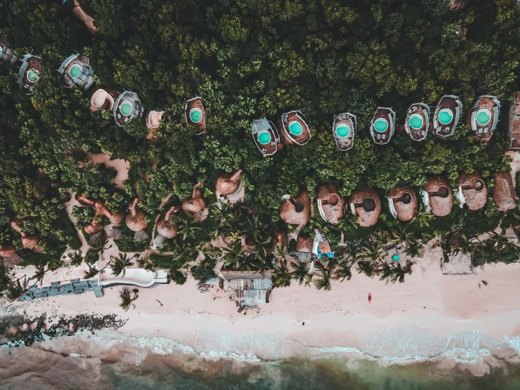 Aerial view of eco-resorts along the Caribbean coast, illustrating where Tulum is located — nestled between the jungle and the sea in Mexico’s Yucatán Peninsula.