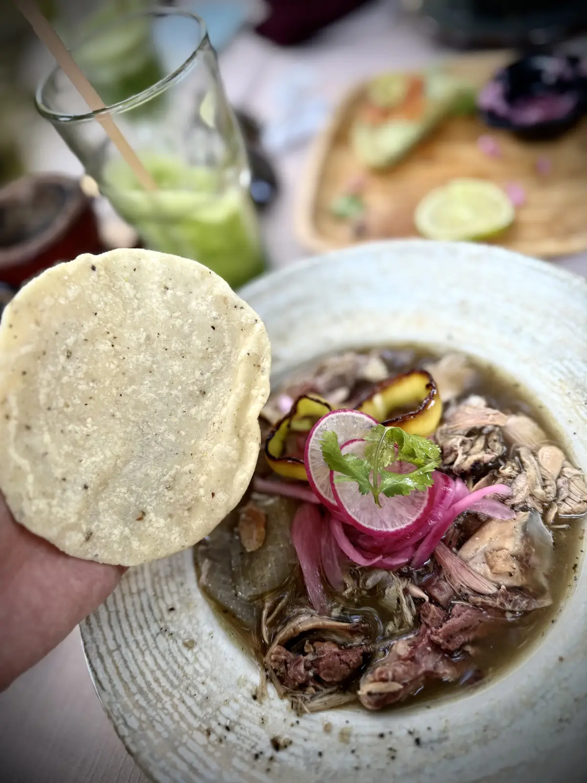Traditional Yucatecan meat broth with pickled onion and tortilla in Valladolid, Mexico.