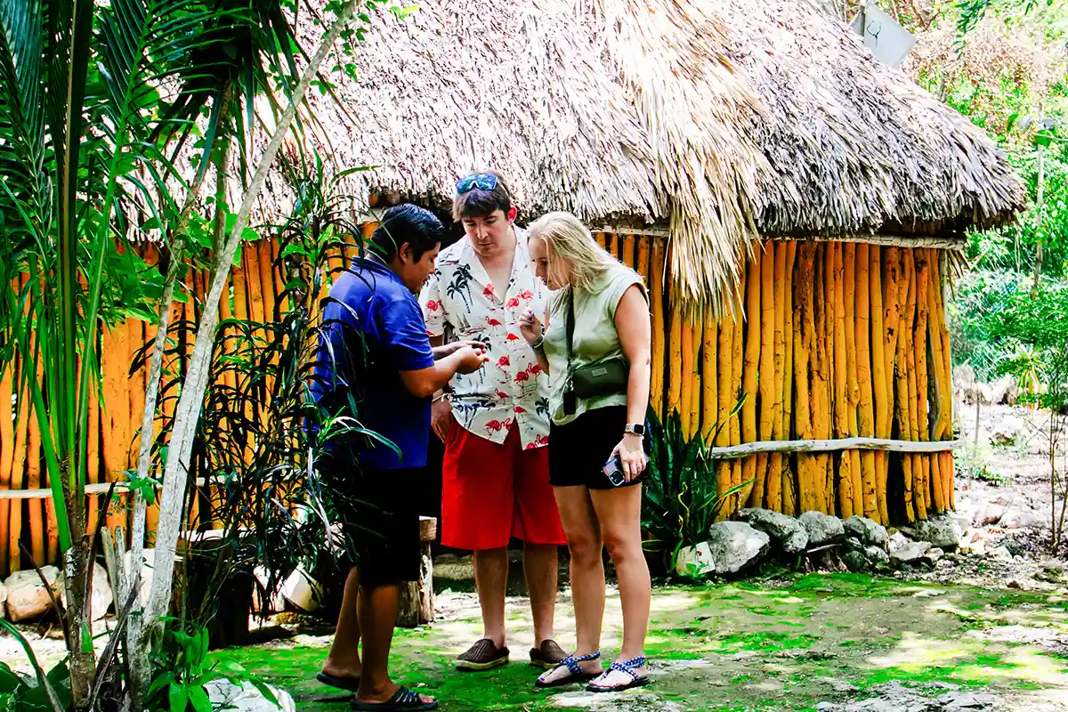  Tourists visiting Mayan village near Coba.
