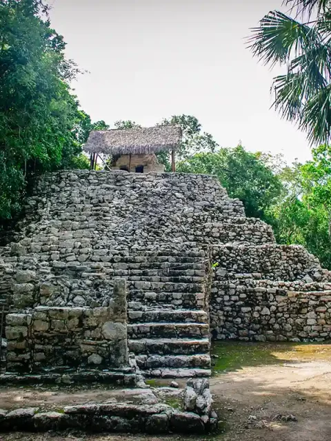 An ancient pyramid made of stone blocks at Coba.