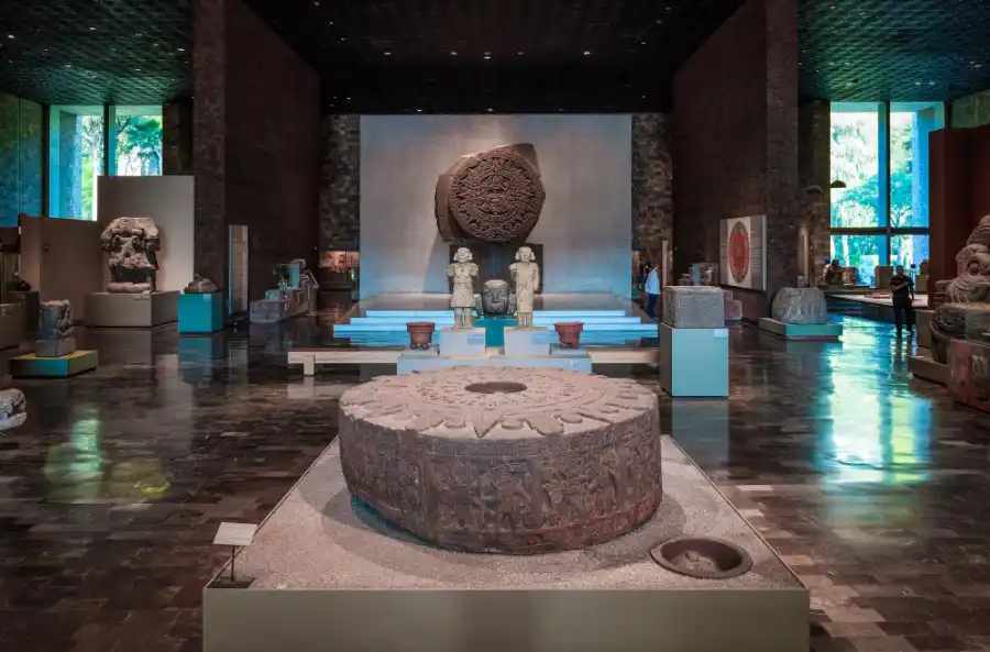 Aztec hall with Sun Stone and ancient relics at Mexico City’s Anthropology Museum.