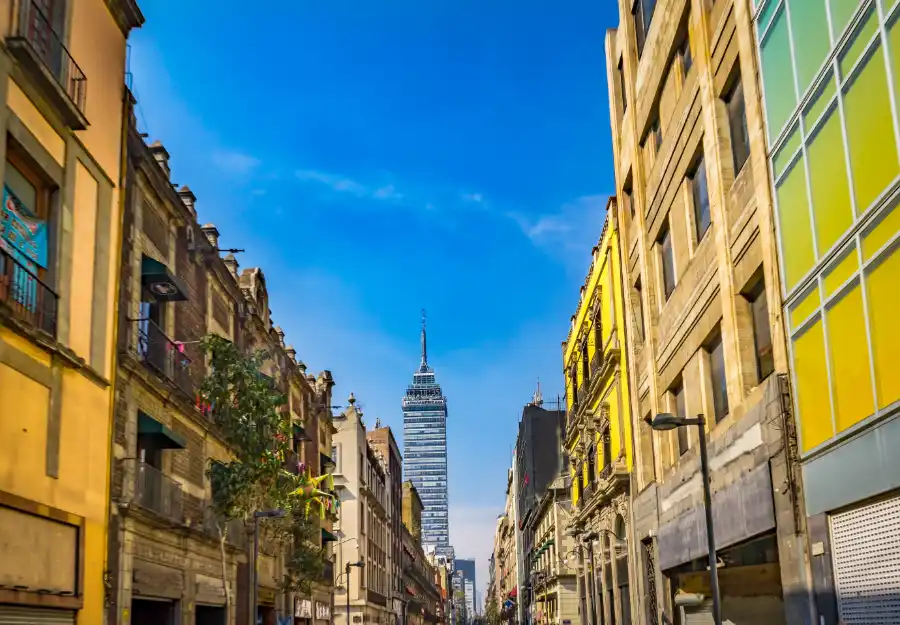 Torre Latinoamericana rising above historical buildings in downtown Mexico City.
