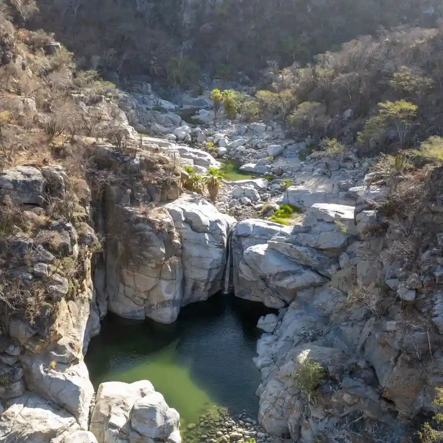 Aerial view of Fox Canyon in Cabo with natural pools between granite rocks.