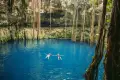 couple-swimming-at-cenote-oxman-yucatan